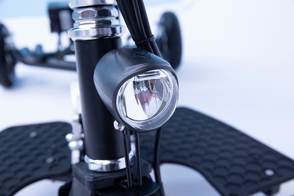 Bright LED headlight on SNAPnGO mobility scooter for safe nighttime travel